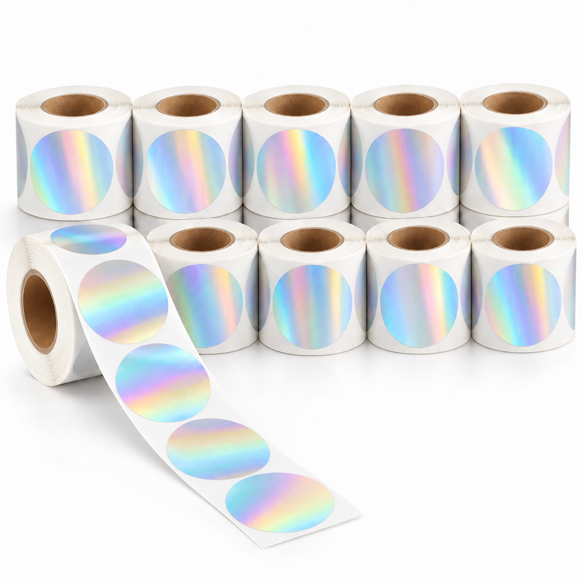 Ten rolls of 50 mm holographic round thermal labels, with one roll unspooled correctly