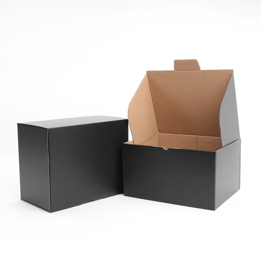 Black rectangular die cut mailing box with an open top, showing the inner cardboard structure.