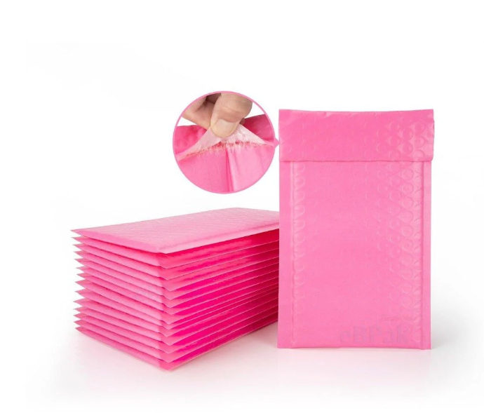 Stack of pink bubble mailers with a close-up inset showing the material.