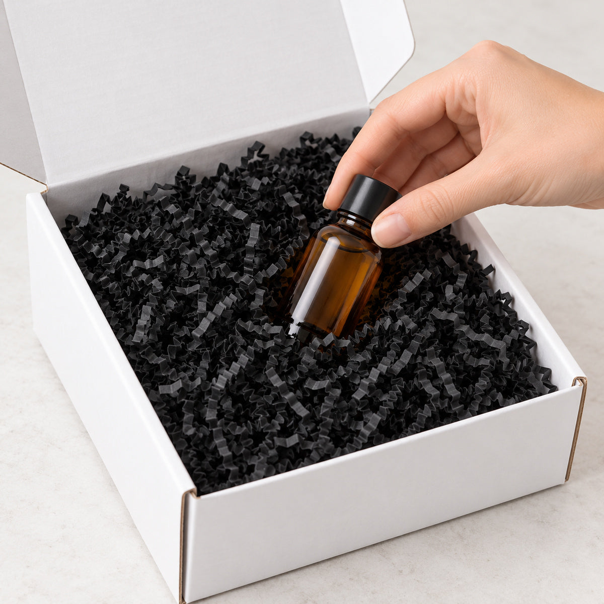 Black shredded paper filler - packing scene