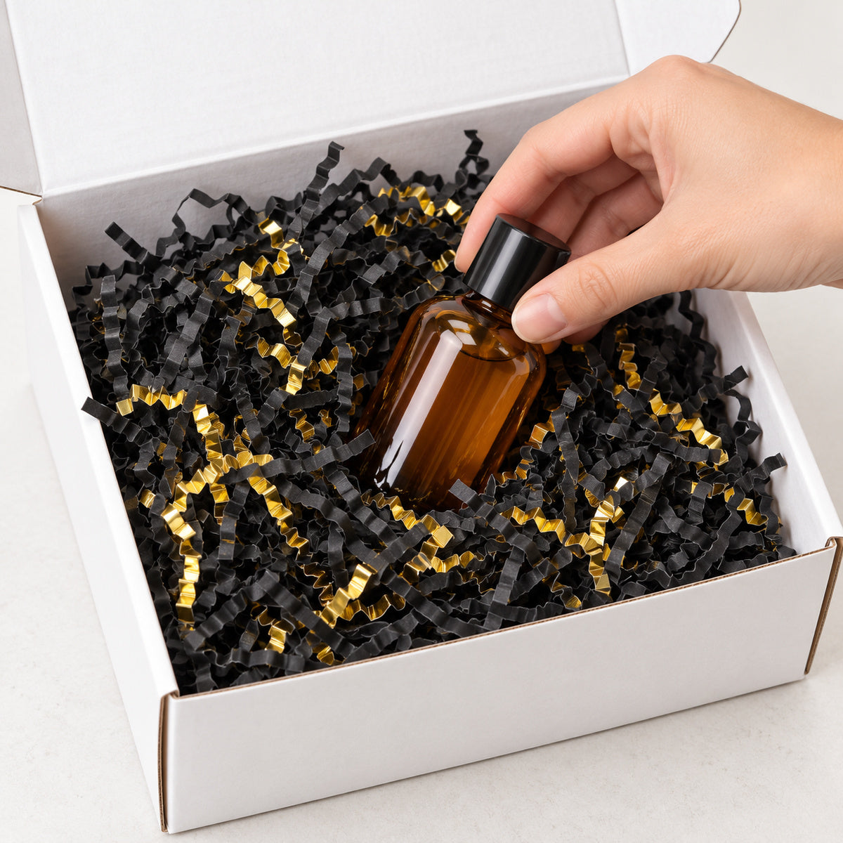 Black and Gold Mix shredded paper filler - packing scene