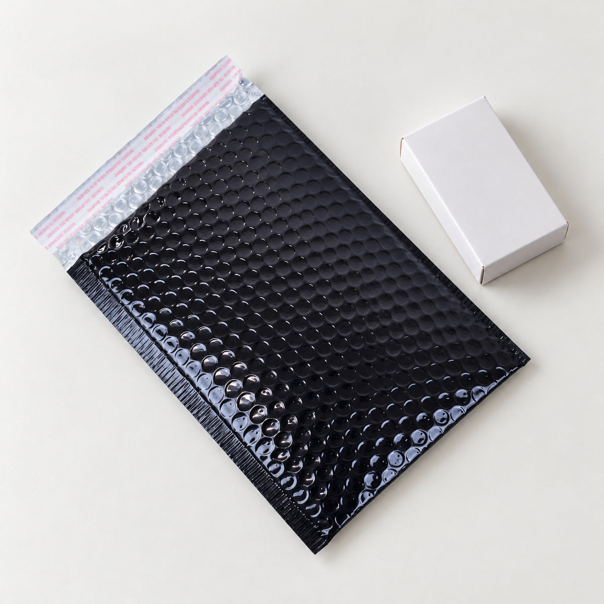 Glossy Black metallic bubble mailer 160 x 230mm - 06-use-gift